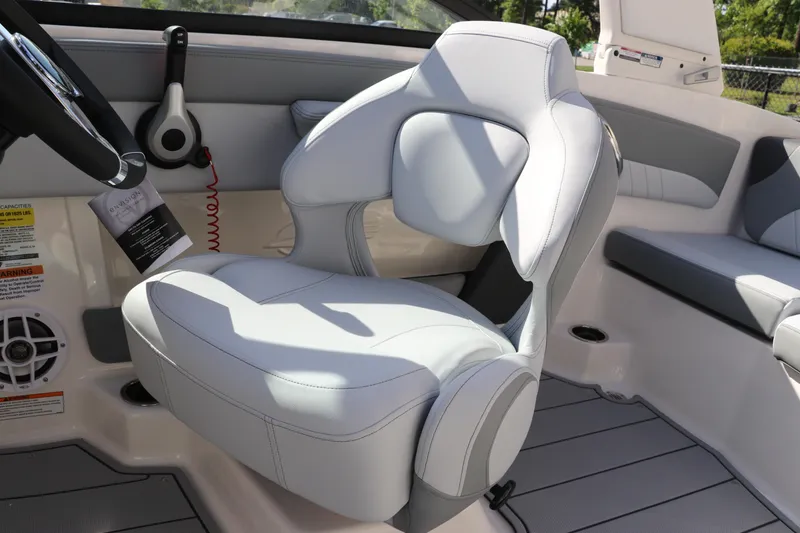 Slide: The Image of 2026 Chaparral 21 SSi OB boat interior with modern seating and steering wheel. - 37