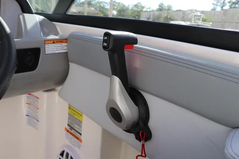 Slide: The Image of Throttle control lever in 2026 Chaparral 21 SSi OB boat interior. - 38