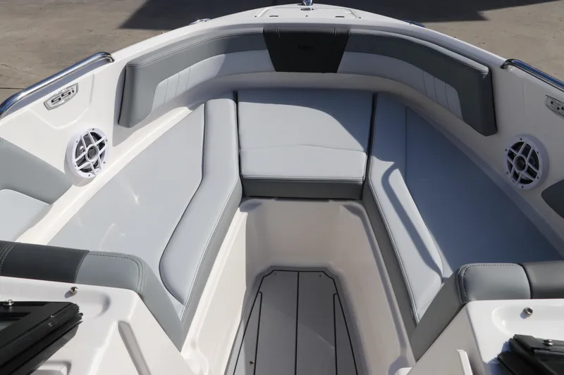 Slide: The Image of 2026 Chaparral 21 SSi OB boat interior with gray seating and built-in speakers. - 43