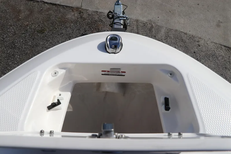 Slide: The Image of Bow storage compartment of 2026 Chaparral 21 SSi OB boat, featuring sleek design. - 47