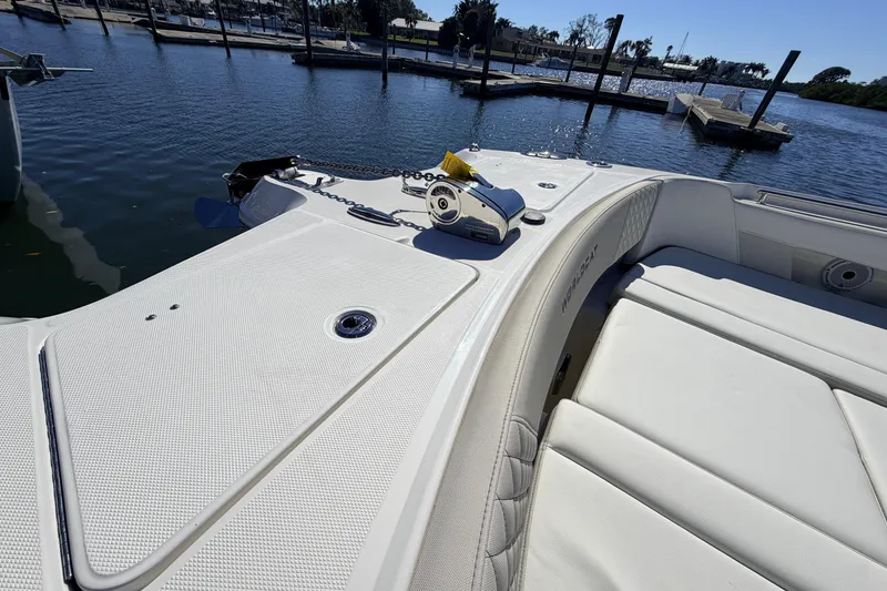 Slide: The Image of 2026 World Cat 325 DC boat deck with anchor, docked in marina. - 21