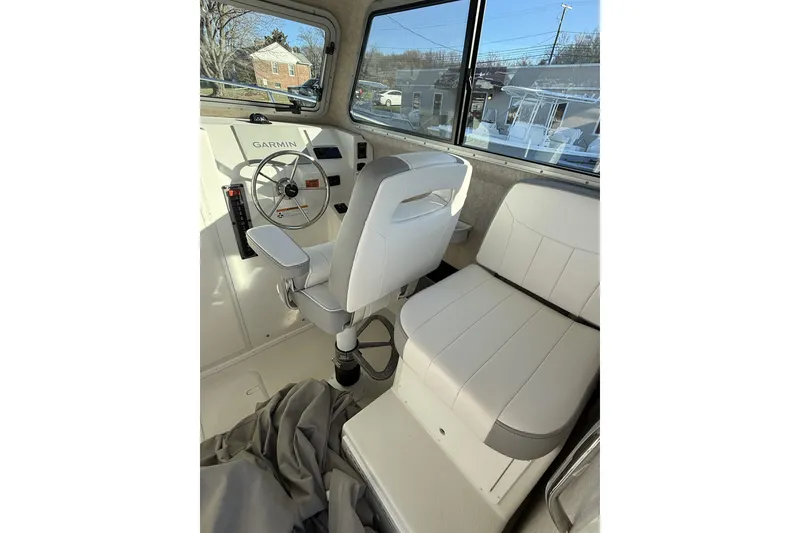 Slide: The Image of 2024 Parker 2520 XLD Sport Cabin interior with steering wheel and seating. - 6