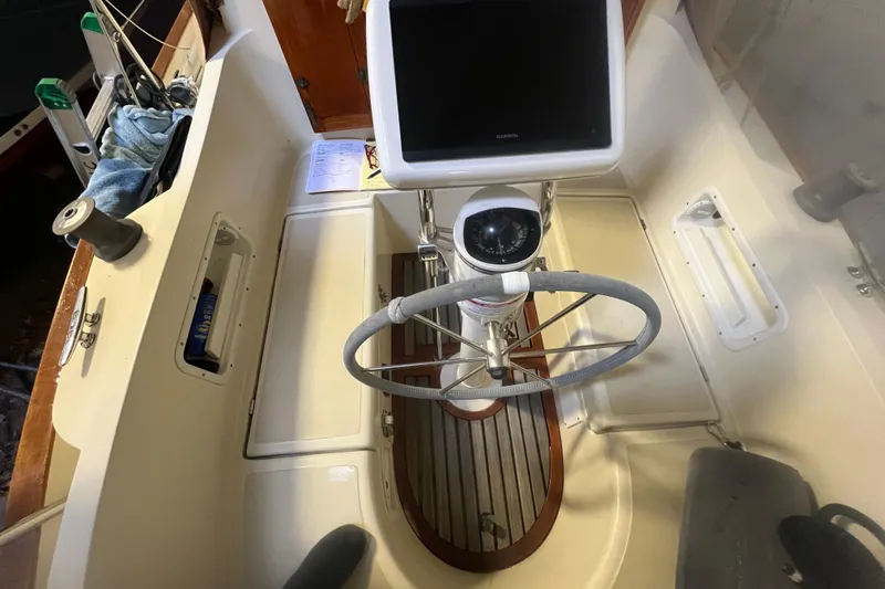 Slide: The Image of Cockpit of 1999 Southern Cross Cutter with steering wheel and navigation equipment. - 14