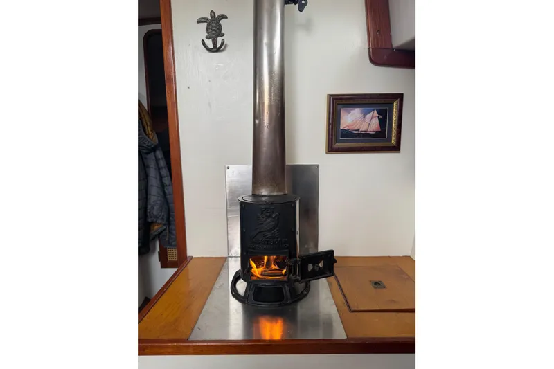 Slide: The Image of Cozy cabin interior with wood stove on a 1999 Southern Cross Cutter sailboat. - 3