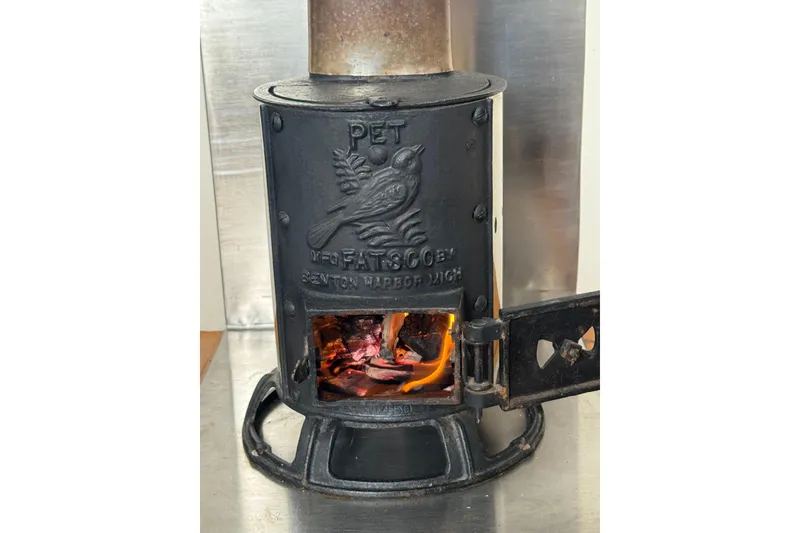 Slide: The Image of Vintage cast iron stove with bird engraving, Southern Cross Cutter 1999 model. - 7