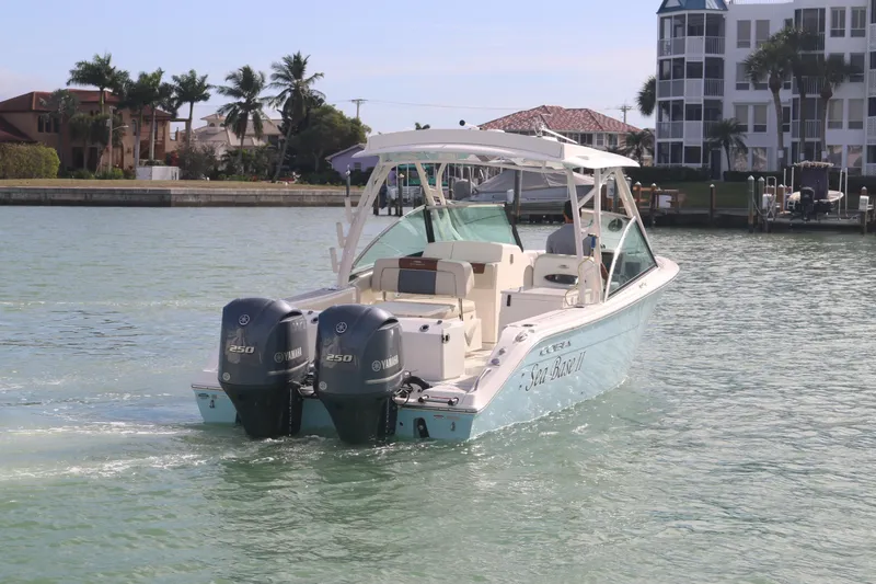 Slide: The Image of Twin Yamaha 250 engines on a 2019 Cobia 280 Dual Console boat. - 12