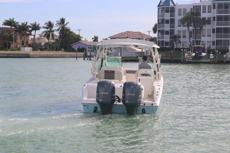 Slide: The Image of Twin Yamaha 250 engines on a 2019 Cobia 280 Dual Console boat. - 13