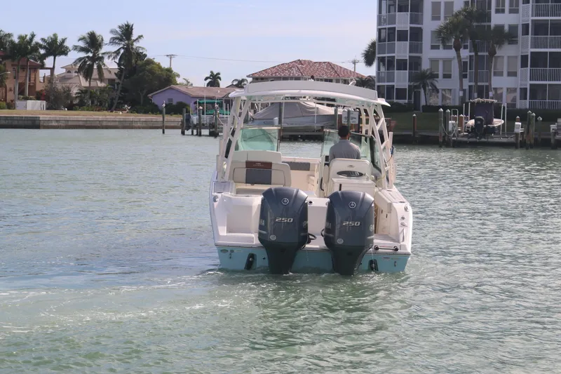 Slide: The Image of Twin Yamaha 250 outboard engines on a 2019 Cobia 280 Dual Console boat. - 14