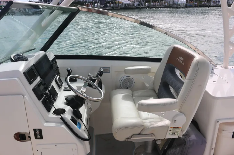 Slide: The Image of 2019 Cobia 280 Dual Console boat bathroom with sink, toilet, and mirror. - 28
