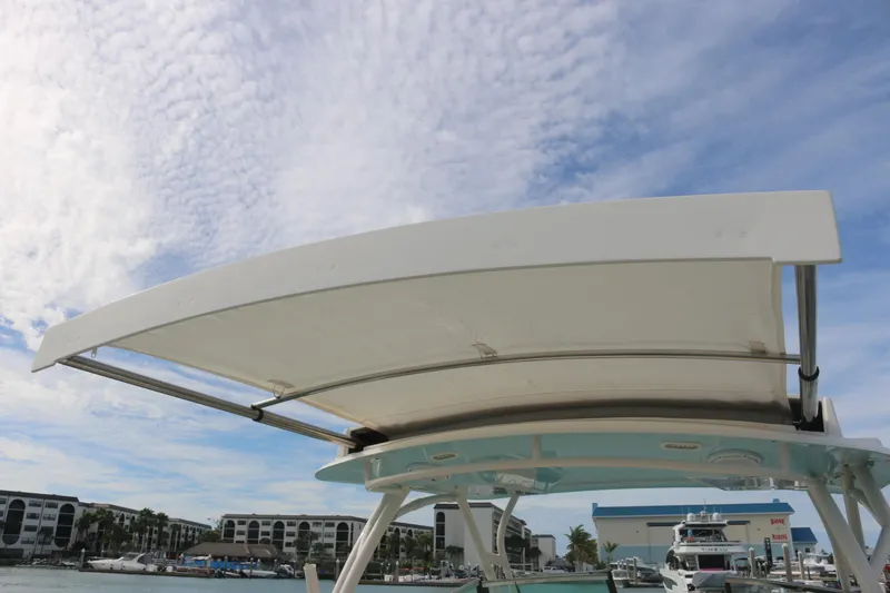 Slide: The Image of 2019 Cobia 280 Dual Console boat with twin Yamaha engines on the water. - 34