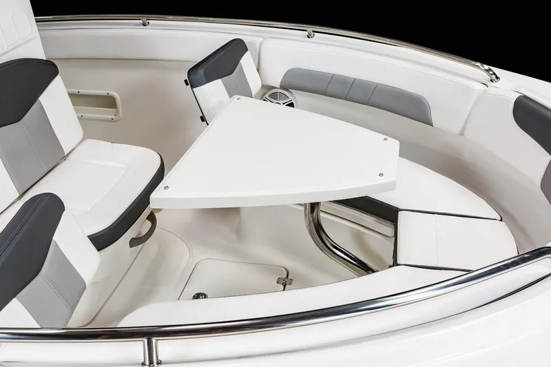 Slide: The Image of Manufacturer Provided Image: 2025 Robalo R222 Explorer boat interior with seating and table. - 7