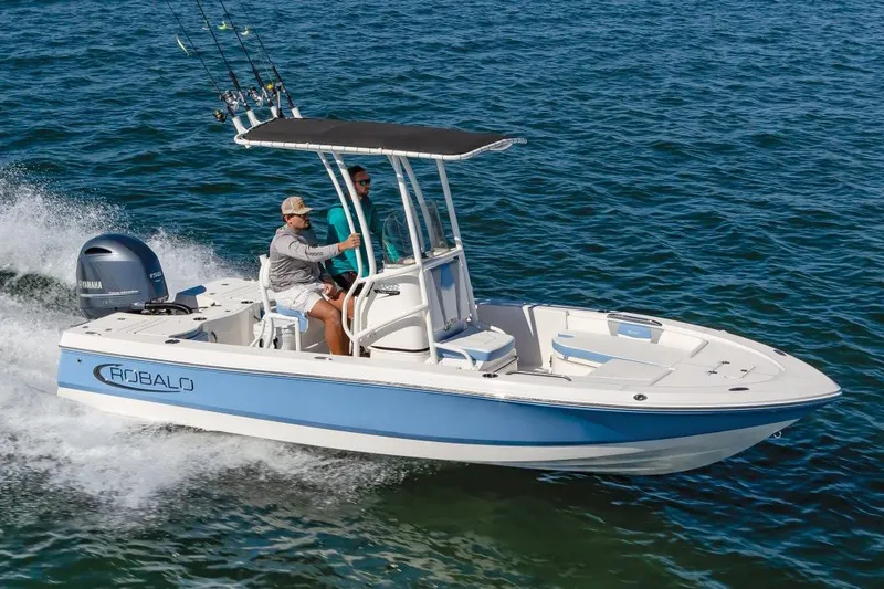 The Image of 2026 Robalo 206 Cayman boat on trailer, parked outdoors, side view. - 0
