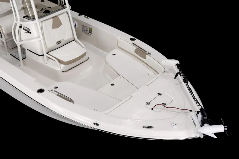 Slide: The Image of 2026 Robalo 206 Cayman boat on trailer, parked outdoors near buildings. - 4