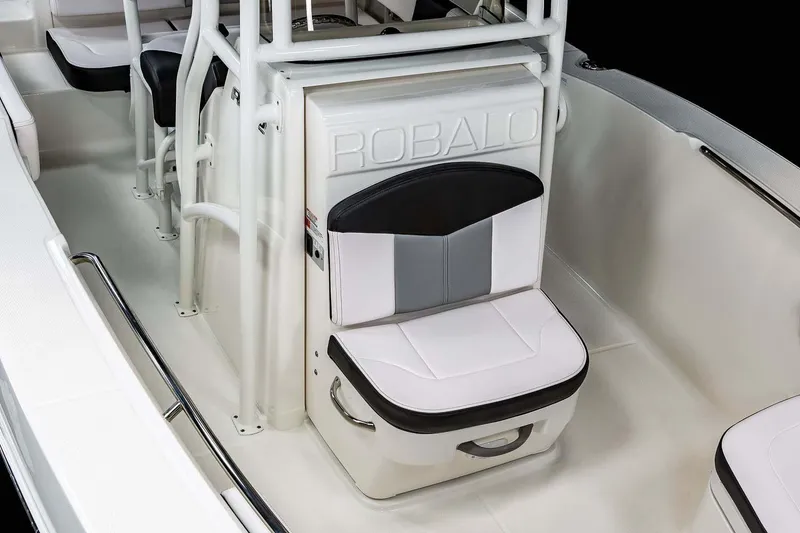 Slide: The Image of Manufacturer Provided Image: 2025 Robalo R202 Explorer boat interior with cushioned seating and sleek design. - 12