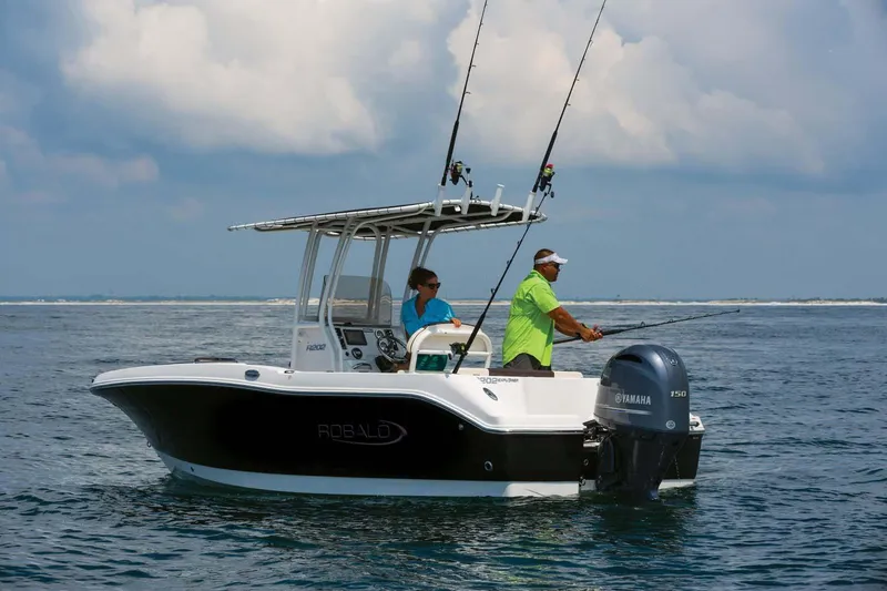 Slide: The Image of Manufacturer Provided Image: 2025 Robalo R202 Explorer boat with anglers fishing in open water. - 4