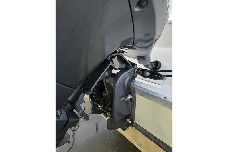 Slide: The Image of 2019 Hurricane SunDeck 237 OB outboard motor detail, showcasing engine mount and components. - 6