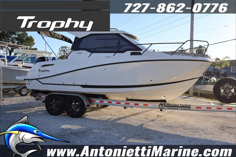 The Image of 2026 Bayliner Trophy T23 Explorer boat on trailer at Antonietti Marine dealership. - 1