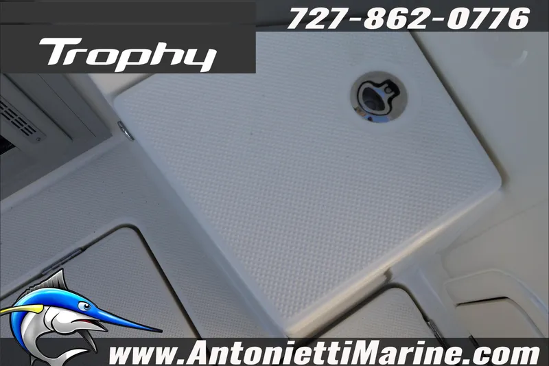 Slide: The Image of 2026 Bayliner Trophy T23 Explorer boat deck detail with contact information. - 11