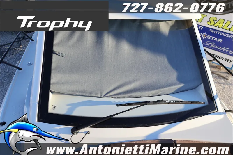 Slide: The Image of Bayliner Trophy T23 Explorer 2026 boat with windshield cover, displayed at Antonietti Marine. - 15