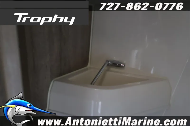 Slide: The Image of Bayliner Trophy T23 Explorer 2026 boat interior with sink, Antonietti Marine contact details. - 22