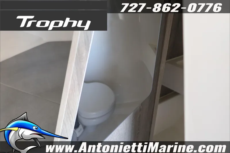Slide: The Image of 2026 Bayliner Trophy T23 Explorer interior with marine toilet, contact Antonietti Marine. - 23