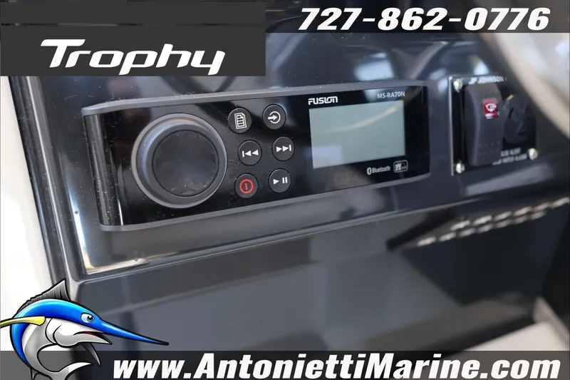 Slide: The Image of 2026 Bayliner Trophy T23 Explorer dashboard with Fusion audio system and contact details. - 29