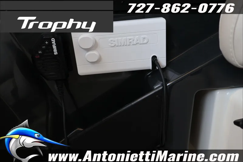 Slide: The Image of 2026 Bayliner Trophy T23 Explorer with Simrad marine electronics, Antonietti Marine branding. - 32