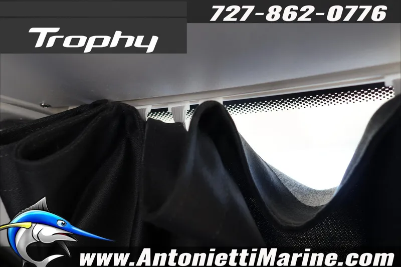 Slide: The Image of 2026 Bayliner Trophy T23 Explorer interior with logo and contact details. - 34