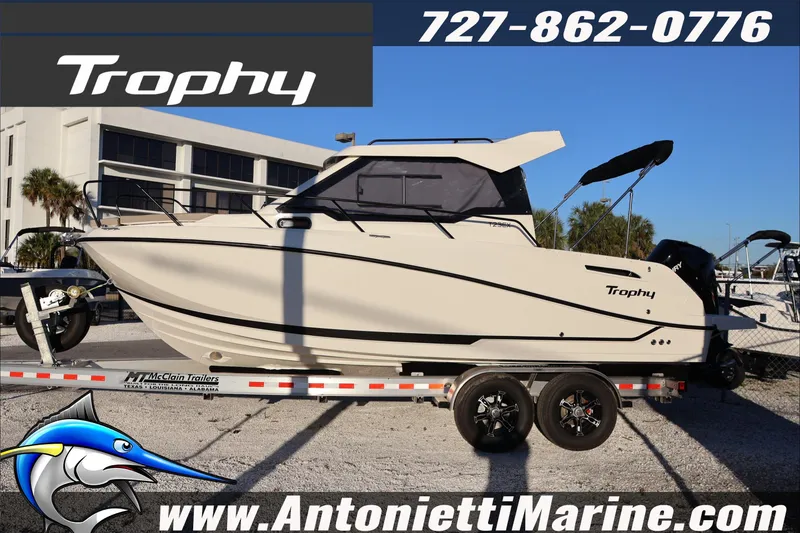 Slide: The Image of 2026 Bayliner Trophy T23 Explorer boat on trailer at Antonietti Marine dealership. - 4