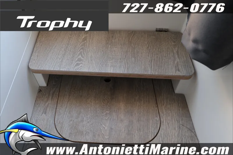 Slide: The Image of 2026 Bayliner Trophy T23 Explorer interior with wooden steps, Antonietti Marine branding. - 47