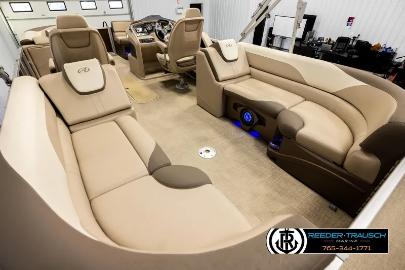 Slide: The Image of Luxurious interior of 2022 Avalon LSZ QL pontoon boat with plush seating and modern dashboard. - 11