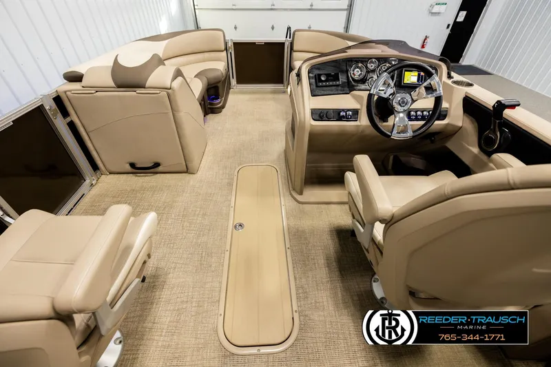 Slide: The Image of Interior of 2022 Avalon LSZ QL pontoon boat with beige seating and modern dashboard. - 17