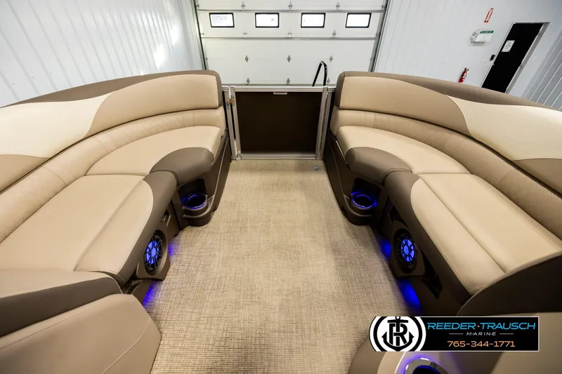 Slide: The Image of Luxurious interior of 2022 Avalon LSZ QL pontoon boat with plush seating and blue LED lighting. - 18