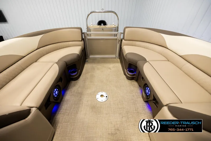 Slide: The Image of Luxurious interior of 2022 Avalon LSZ QL pontoon boat with beige seating and blue LED lights. - 20