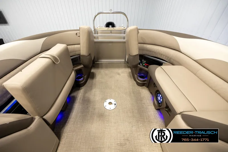Slide: The Image of Luxurious interior of 2022 Avalon LSZ QL pontoon boat with beige seating and blue lighting. - 22