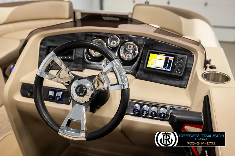 Slide: The Image of 2022 Avalon LSZ QL boat dashboard with steering wheel and navigation system. - 28