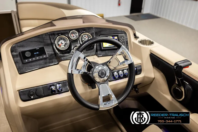 Slide: The Image of 2022 Avalon LSZ QL boat dashboard with steering wheel and control panel. - 29