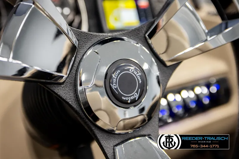 Slide: The Image of Close-up of 2022 Avalon LSZ QL steering wheel with chrome accents. - 30