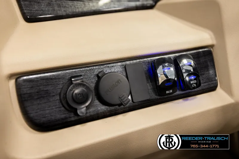 Slide: The Image of Control panel of 2022 Avalon LSZ QL with switches and 12V outlet. - 31