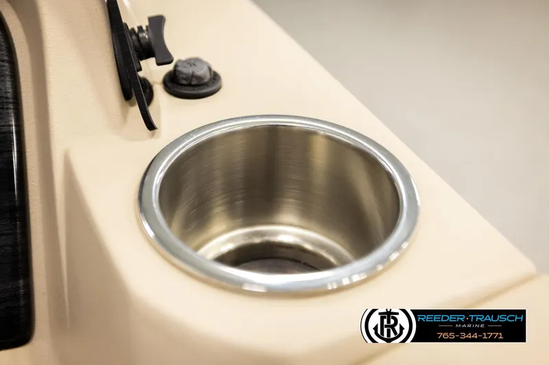 Slide: The Image of Cup holder on 2022 Avalon LSZ QL boat console, Reeder-Trausch Marine logo visible. - 35
