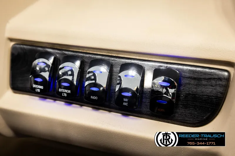 Slide: The Image of Control panel of 2022 Avalon LSZ QL boat with illuminated switches for various functions. - 36