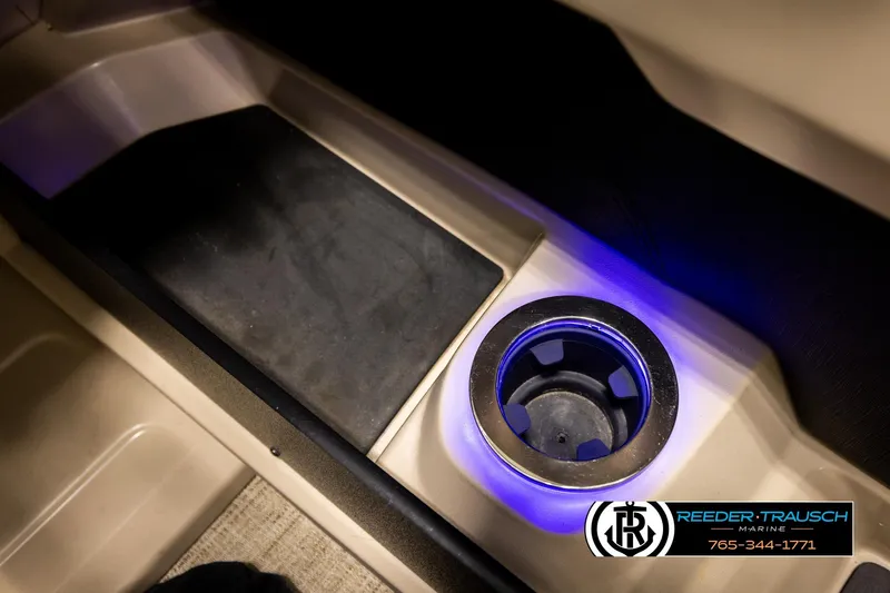 Slide: The Image of 2022 Avalon LSZ QL boat interior with illuminated cup holder and footrest. - 38