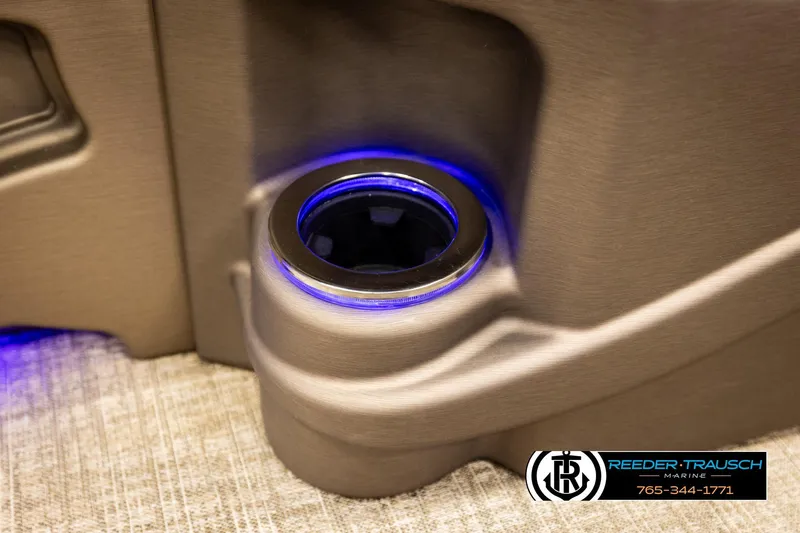 Slide: The Image of Illuminated cup holder in 2022 Avalon LSZ QL boat interior, featuring blue LED lighting. - 40