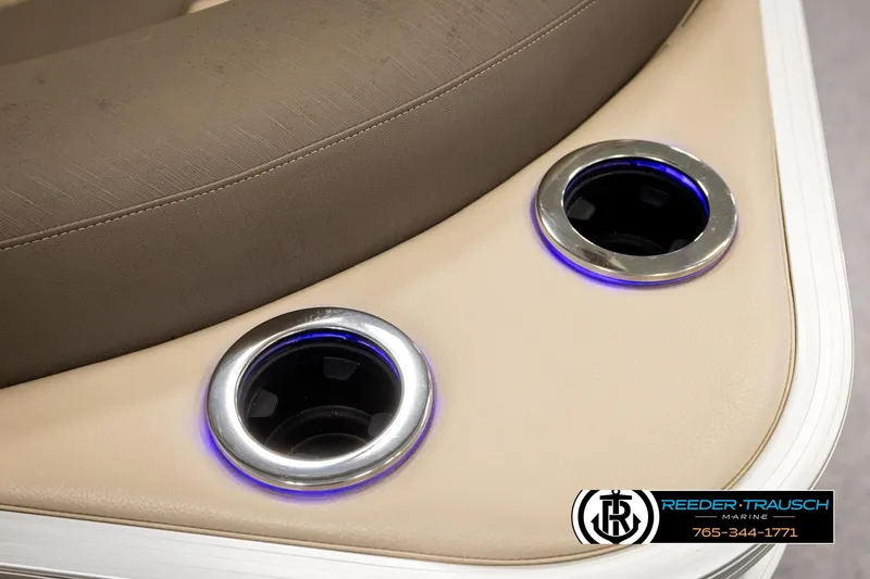 Slide: The Image of 2022 Avalon LSZ QL boat interior with illuminated cup holders and beige seating. - 45