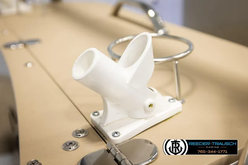 Slide: The Image of White rod holder on 2022 Avalon LSZ QL boat deck, Reeder-Trausch Marine logo visible. - 46