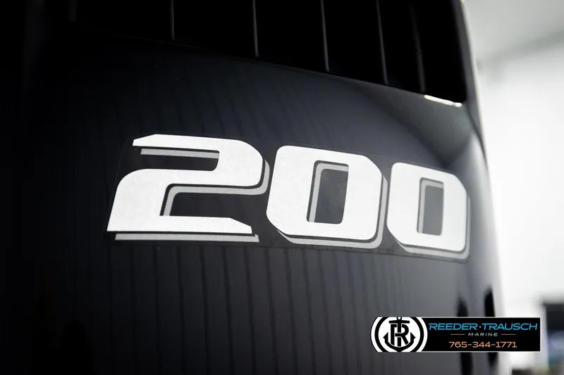 Slide: The Image of Close-up of 2022 Avalon LSZ QL engine with '200' decal, Reeder-Trausch Marine logo visible. - 49