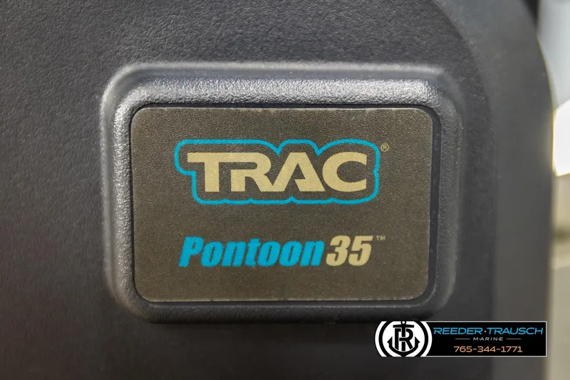 Slide: The Image of TRAC Pontoon35 label on Avalon LSZ QL 2022 model, Reeder-Trausch Marine branding. - 53