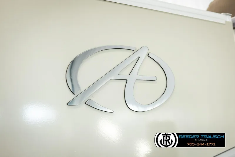 Slide: The Image of 2022 Avalon LSZ QL logo on beige surface, Reeder-Trausch Marine branding. - 54