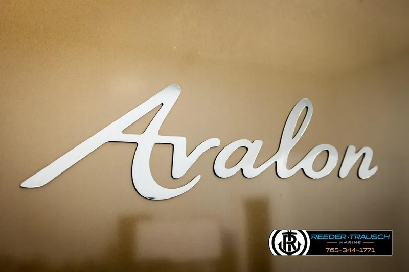 Slide: The Image of 2022 Avalon LSZ QL logo on a sleek metallic surface, Reeder-Trausch Marine branding. - 55