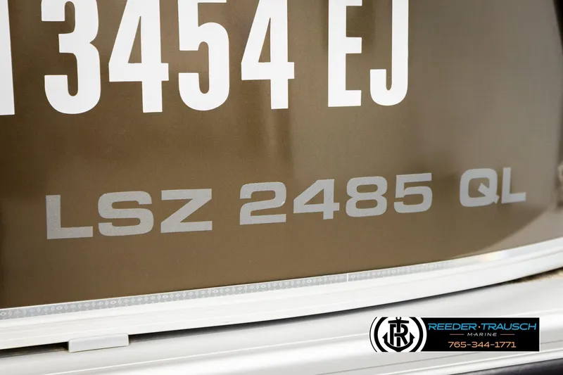 Slide: The Image of 2022 Avalon LSZ QL boat with registration number, Reeder-Trausch Marine logo visible. - 56